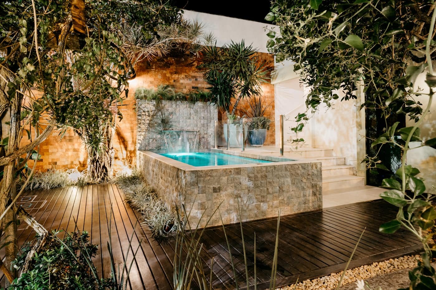 Modern backyard pool, patio, and clean landscaping